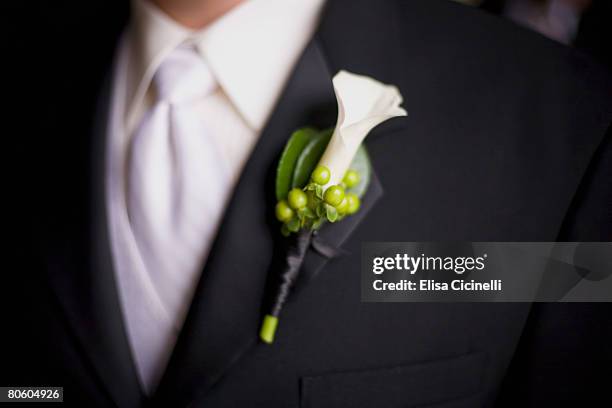 groom in white tie wearing boutonniere - boutonniere ストックフォトと画像