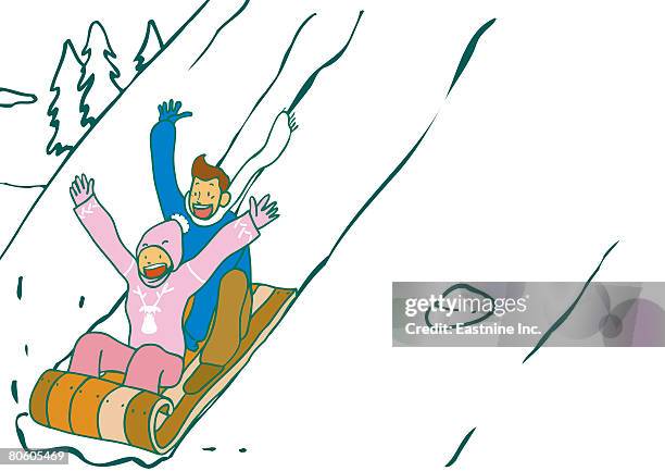 couple riding on a sled and smiling - toboggan stock illustrations