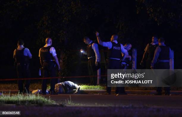 Chicago Police officer investigate the crime scene where a man was shot and killed on the Near West Side on July 2, 2017 in Chicago, Illinois. Local...