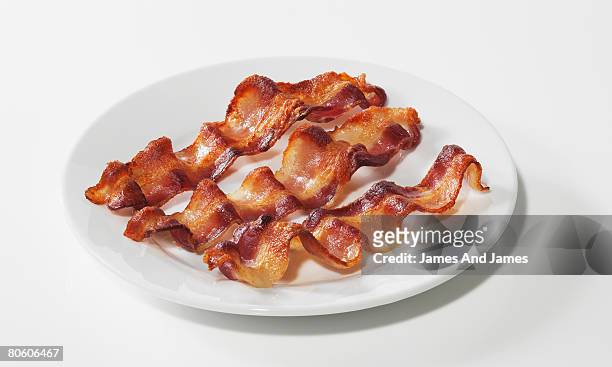 bacon on plate - speck stock-fotos und bilder
