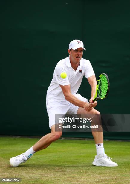 Sam Querrey of the United States plays a backhand during the Gentlemen's Singles first round match against Thomas Fabbiano of Italy on day one of the...