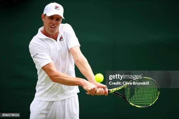 Sam Querrey of the United States plays a backhand during the Gentlemen's Singles first round match against Thomas Fabbiano of Italy on day one of the...