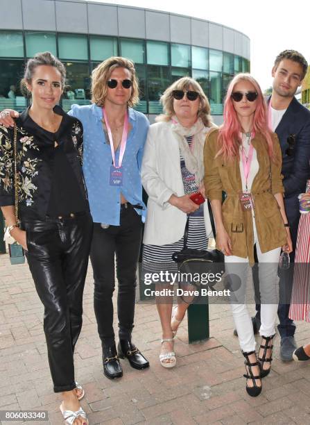 Louise Roe, Dougie Poynter, Catherine Guinness, Mary Charteris and Douglas Booth attend the evian Live Young suite during Wimbledon 2017 at the All...