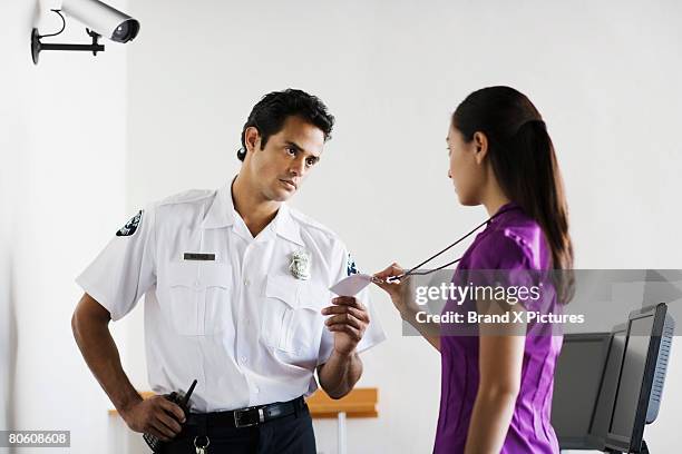 169 Security Guard Checking Identification Stock Photos, High-Res ...