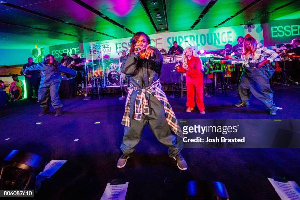 Tamika Scott, Kandi Burruss, Tameka 'Tiny' Harris, and LaTocha Scott of Xscape perform in concert at the 2017 Essence Festival at Mercedes-Benz...