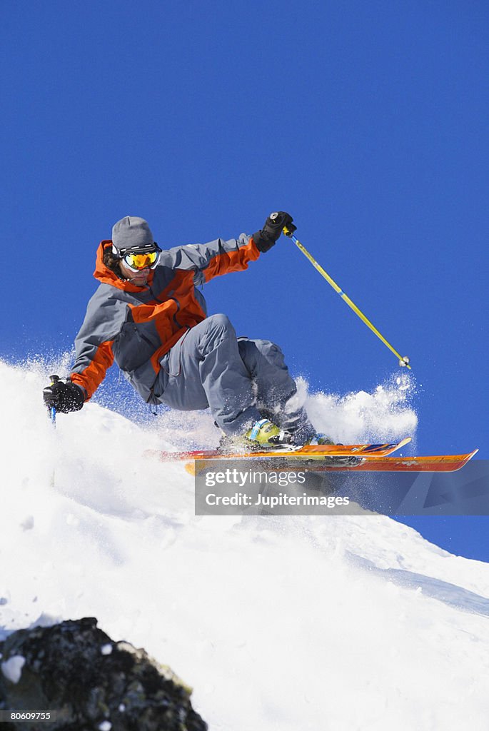 Downhill skier in mid-air