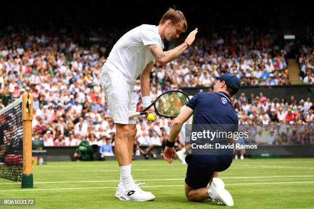 Alexander Bublik of Kazakhstan jokes with a ball boy during the Gentlemen's Singles first round match against Andy Murray of Great Britain on day one...