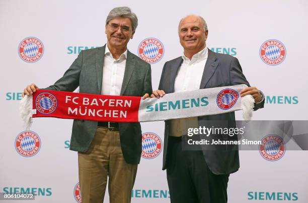Uli Hoeness , president of Bundesliga football club FC Bayern Muenchen and Joe Kaeser, CEO of Siemens address the media during a press conference...