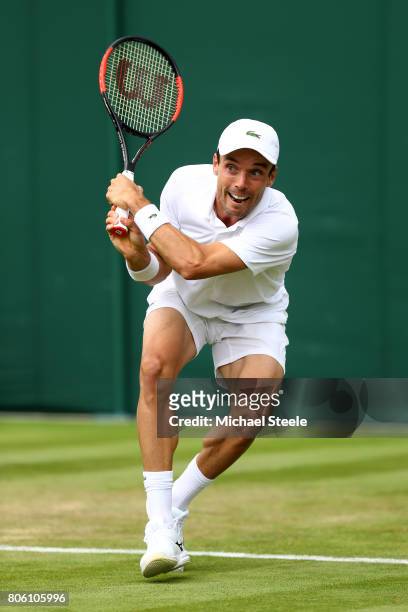Roberto Bautista Agut of Spain plays a backhand during the Gentlemen's Singles first round match against Andreas Haider-Maurer of Austria on day one...