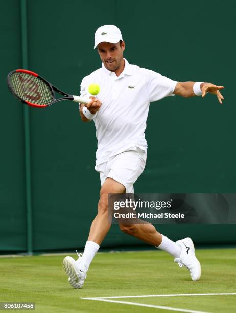 Roberto Bautista Agut of Spain plays a forehand during the Gentlemen's Singles first round match against Andreas Haider-Maurer of Austria on day one...