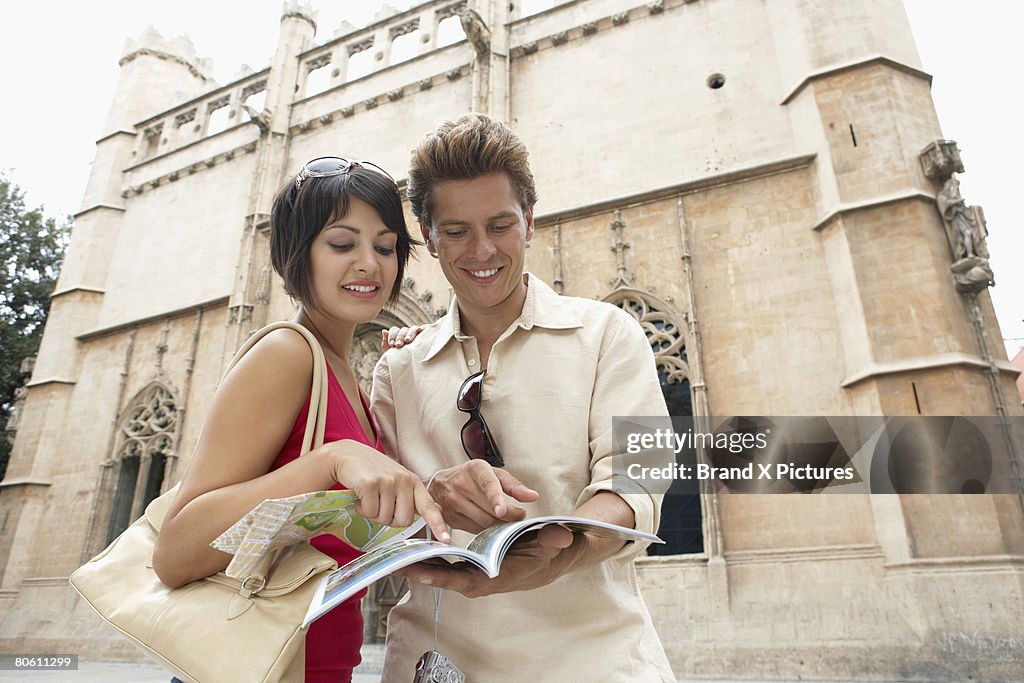 Couple looking at sightseeing book