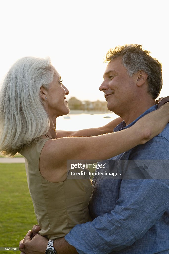 Affectionate Couple Hugging High-Res Stock Photo - Getty Images