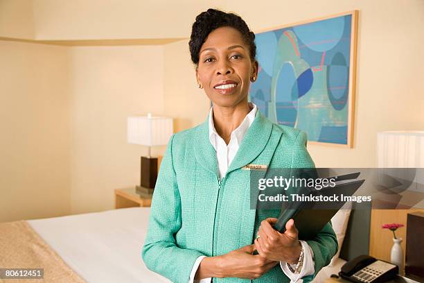 manager in hotel room - hotel manager stockfoto's en -beelden