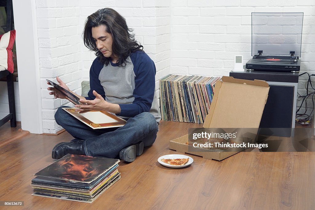 Man looking at records