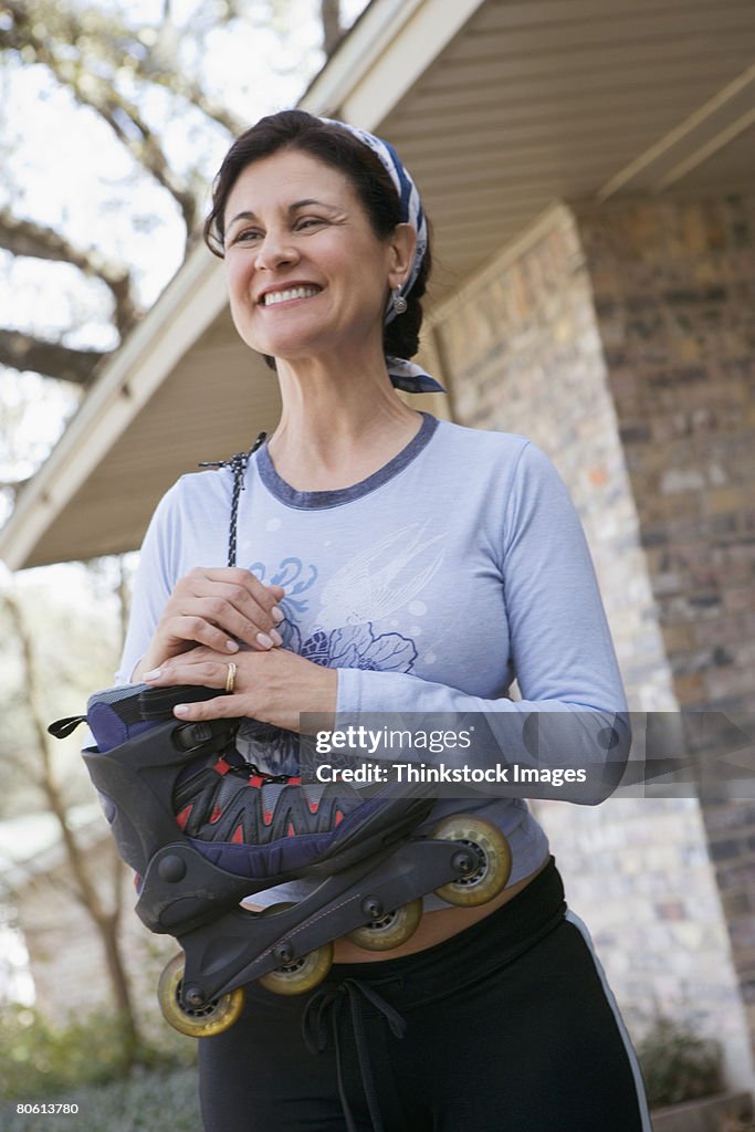 Smiling woman with inline skate