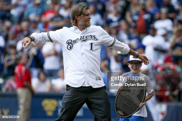 Former Milwaukee Brewers Corey Hart throws the ceremonial first pitch before the game against the Miami Marlins at Miller Park on June 30, 2017 in...