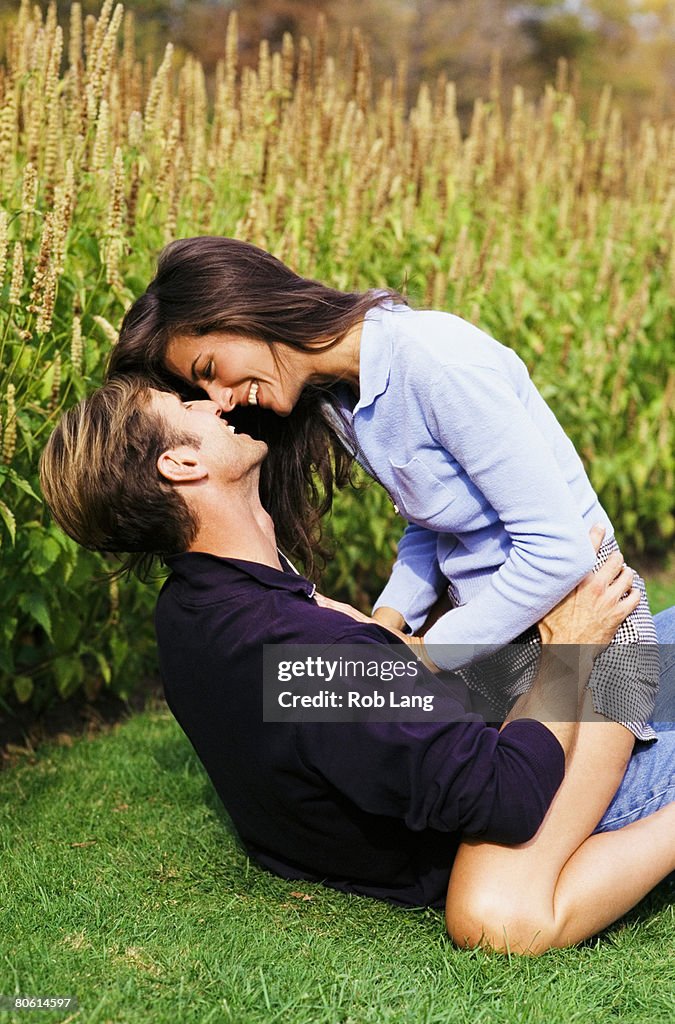 Affectionate couple in field