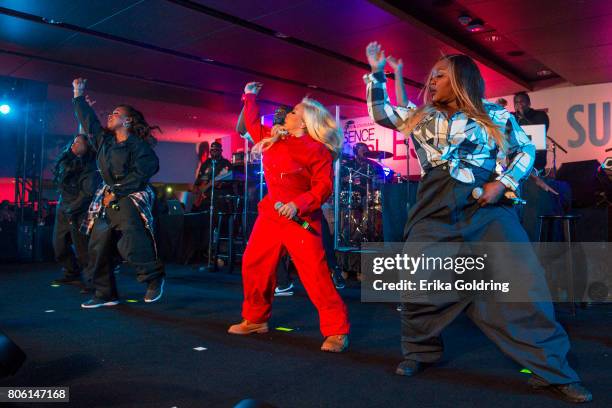 Tamika Scott, Kandi Burruss, Tameka 'Tiny' Harris, and LaTocha Scott of Xscape performperform onstage at the 2017 ESSENCE Festival Presented By Coca...