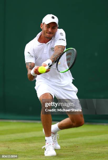 Andreas Haider-Maurer of Austria plays a backhand during the Gentlemen's Singles first round match against Roberto Bautista Agut of Spain on day one...