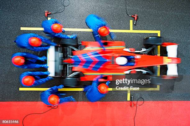 racecar driver at the pit stop - pit stop top view stock pictures, royalty-free photos & images