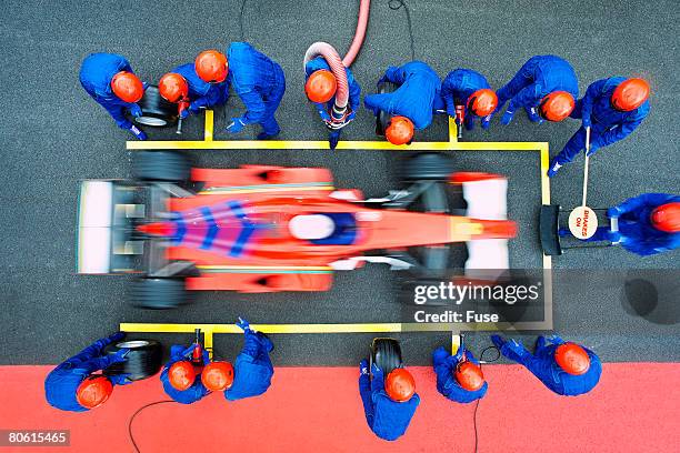 racecar driver at the pit stop - pit stop top view stock pictures, royalty-free photos & images