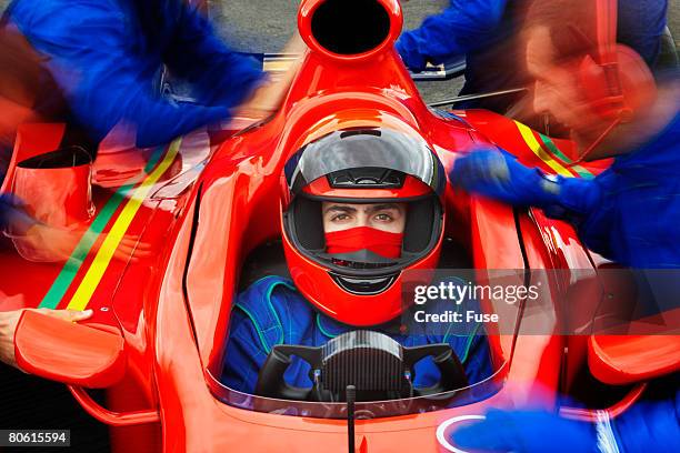 racecar driver at the pit stop - race car driver portrait stock pictures, royalty-free photos & images