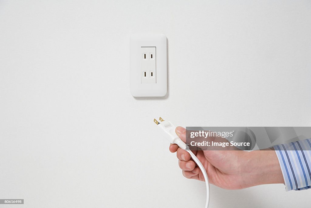 Person using a plug
