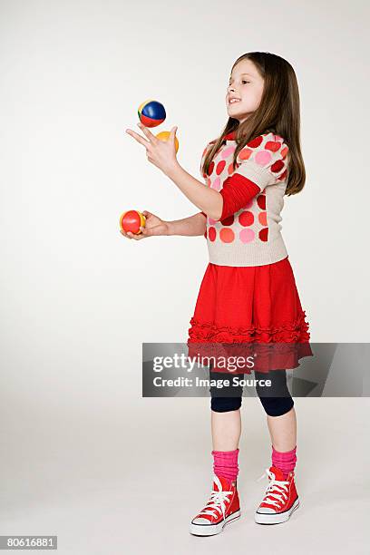 a girl juggling - juggling stock pictures, royalty-free photos & images