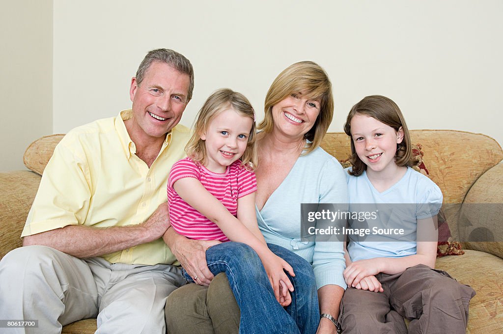 Family sitting on a sofa