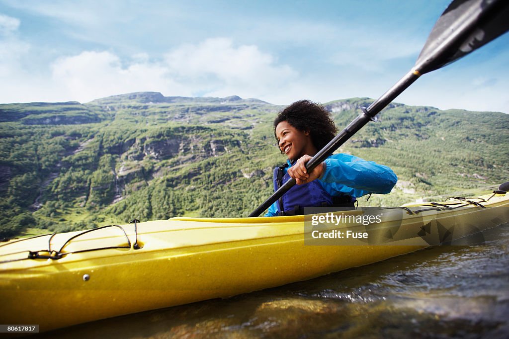 Woman Paddling a Kayak