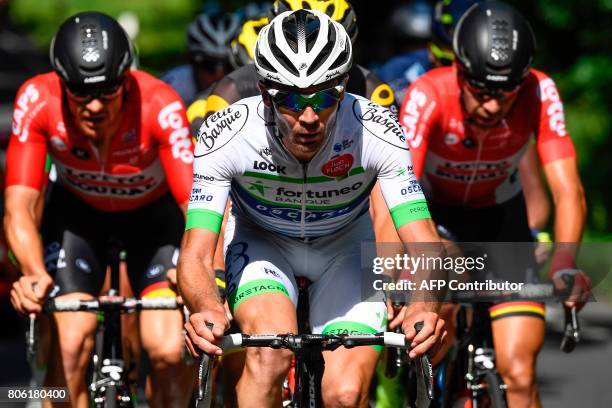 France's Pierre-Luc Perichon rides in a breakaway between Australia's Adam Hansen and Belgium's Thomas De Gendt during the 212,5 km third stage of...