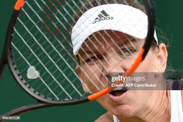 Romania's Simona Halep returns against New Zealand's Marina Erakovic during their women's singles first round match on the first day of the 2017...