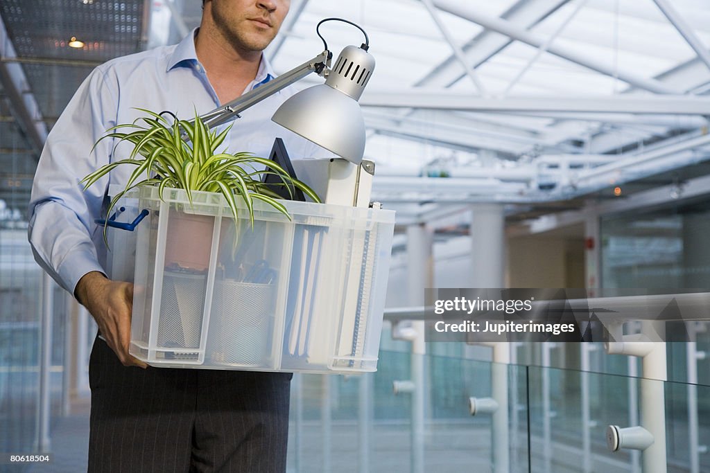Man carrying business objects