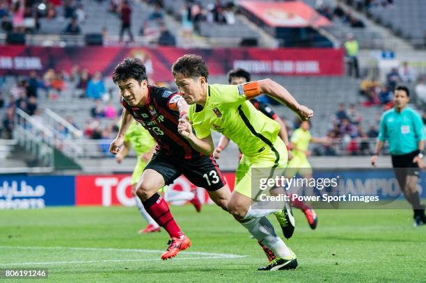 Urawa Reds Midfielder Ugajin Tomoya fights for the ball with FC Seoul Midfielder Go Yohan during the AFC Champions League 2017 Group F match between...