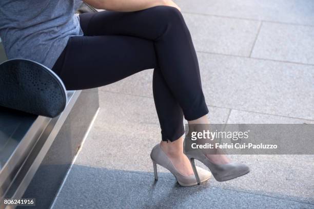 young woman's legs and high heel at street of los angeles in usa - woman in broken shoe heel stockfoto's en -beelden