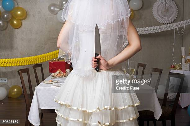 vengeful bride with kitchen knife - hands behind back stock photos et images de collection