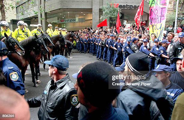 Australian police and anti-globalization protesters face off outside the Sydney Stock Exchange, May 1, 2001 in Sydney, Australia.