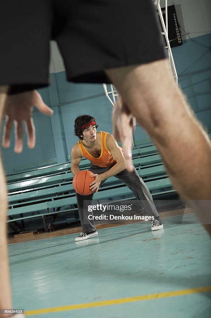 Two basketball players playing basketball