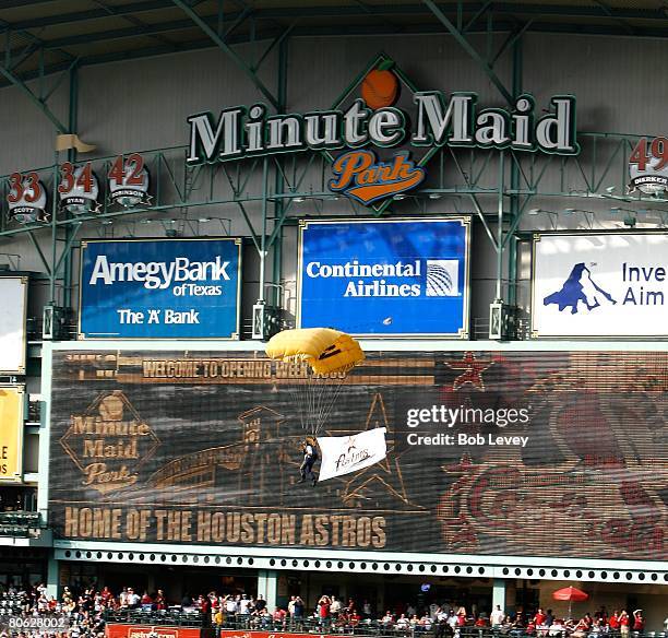 Navy elite skydive team "The Leapfrogs" perform during pregame ceremonies before the St. Louis Cardinals play the Houston Astros on April 7, 2008 at...