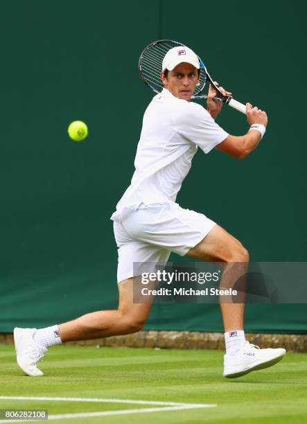 Andrew Whittington of Australia plays a backhand during the Gentlemen's Singles first round match on day one of the Wimbledon Lawn Tennis...