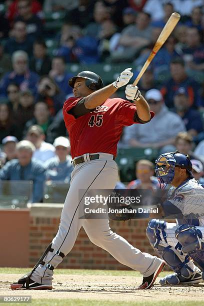 Carlos Lee of the Houston Astros swings at a pitch against the Chicago Cubs during the game on April 5, 2008 at Wrigley Field in Chicago, Illinois.