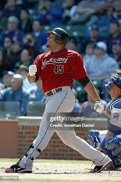 Carlos Lee of the Houston Astros connects with a pitch against the Chicago Cubs during the game on April 5, 2008 at Wrigley Field in Chicago,...
