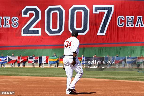 David Ortiz of the Boston Red Sox heads out on to the field to get his 2007 World Series Championship ring before the game the Detroit Tigers on...