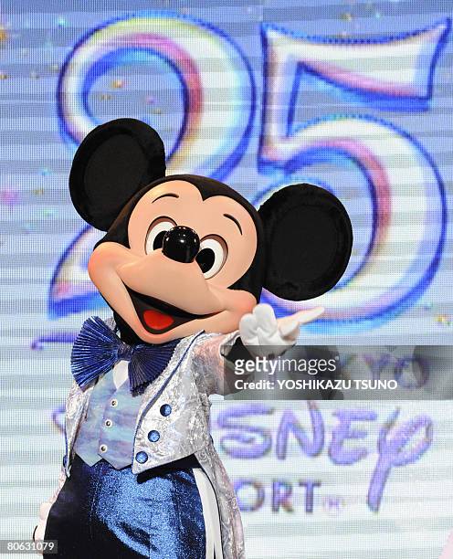 Mickey Mouse performs at a press event to celebrate Tokyo Disneyland's 25th anniversary at the Disney teme park at Urayasu city in Chiba prefecture...