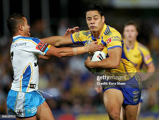 Jarryd Hayne of the Eels is tackled by Scott Prince of the Titans during the round five NRL match between the Parramatta Eels and the Gold Coast...