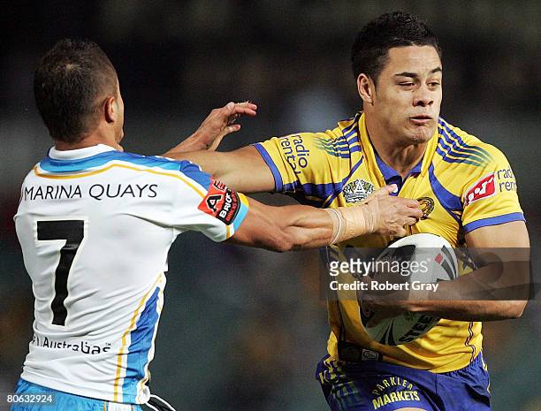 Jarryd Hayne of the Eels is tackled by Scott Prince of the Titans during the round five NRL match between the Parramatta Eels and the Gold Coast...