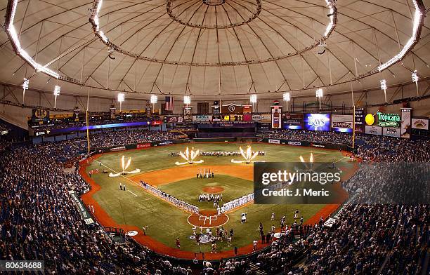 General view as the Seattle Mariners and the Tampa Bay Rays lineup on the foul lines for the National Anthem just before the start of the game on...