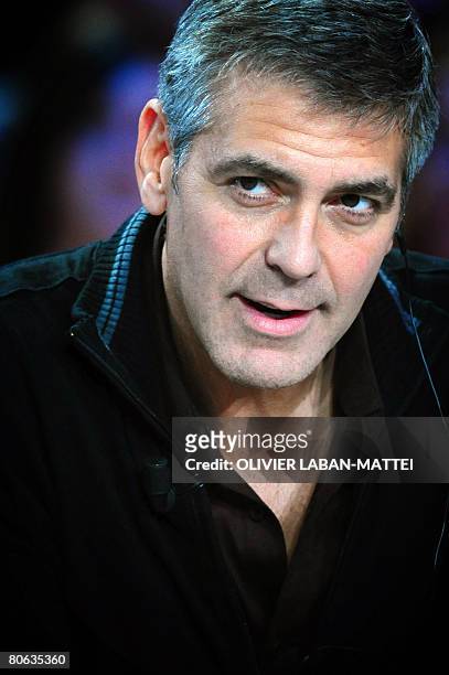 Actor and film director George Clooney gives an interview during the French TV channel Canal+ show 'Le Grand Journal', April 11, 2008 in Paris. AFP...