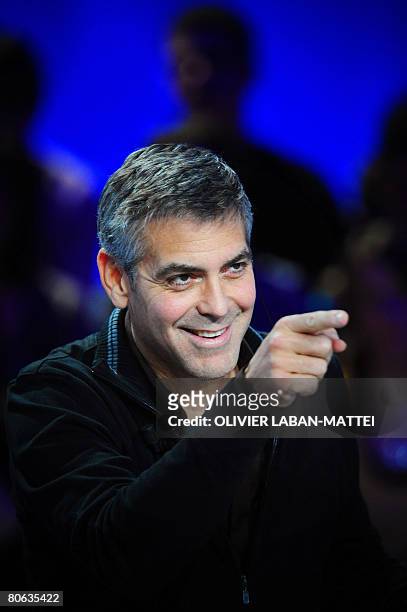 Actor and film director George Clooney gives an interview during the French TV channel Canal+ show 'Le Grand Journal', April 11, 2008 in Paris. AFP...