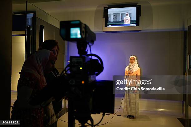 Misky Sharif of Lansdowne, Virginia, reads a news script for the television camera in the "Be A TV Reporter" section of The Newseum during its grand...